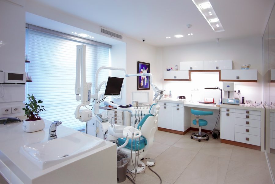 Bright, modern dental clinic interior with teal accents